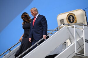 US President Donald Trump, with US First Lady Melania Trump, arrives at Wright-Patterson Air Force Base in Ohio on August 7, 2019. Trump is visiting the mass shooting sites in Dayton, Ohio, and El Paso, Texas. - Nine people were killed on August 4 in Dayton's popular Oregon District. (Photo by SAUL LOEB / AFP)