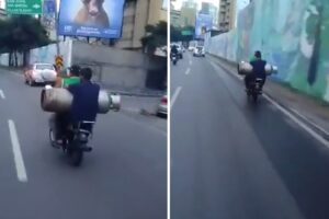 Captaron a dos hombres llevando una bombona de gas de 43 kilos en una moto en la autopista Francisco Fajardo (+Video)