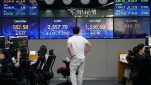 Asian shares fall, tracking a decline on Wall St on fears rates may stay high