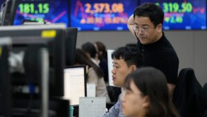 Asian shares trade mixed ahead of a key US jobs report