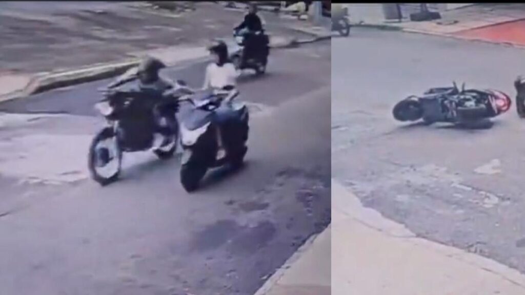 Momento en el que una mujer es arrastrada en su moto por un motoladrón en Bucaramanga