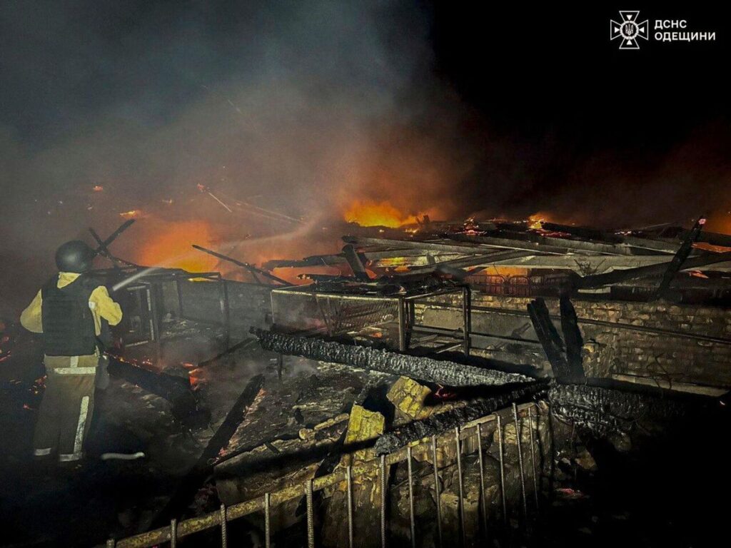 In this photo provided by the Ukrainian Emergency Services on Saturday, Sept. 20, 2025, a rescue worker puts out a fire of a barn destroyed by a Russian strike in Odesa region, Ukraine. (Ukrainian Emergency Service via AP). AP PROVIDES ACCESS TO THIS PUBLICLY DISTRIBUTED HANDOUT PHOTO PROVIDED BY UKRAINIAN EMERGENCY SERVICE; MANDATORY CREDIT