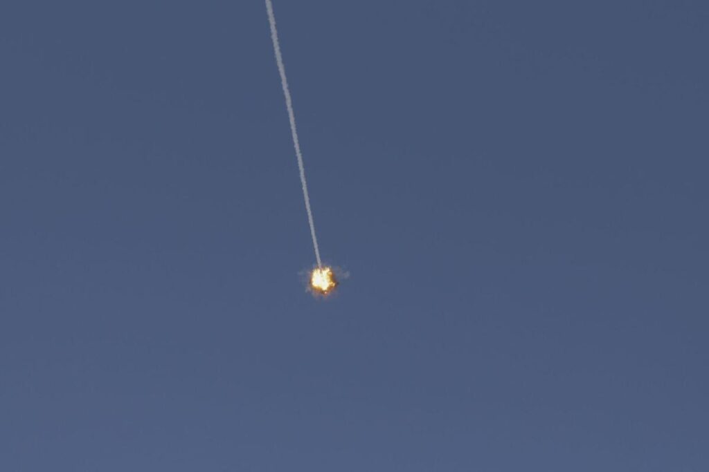 This picture taken from a position in the Upper Galilee region in northern Israel shows an Israeli Iron Dome missile streaking across the sky to intercept incoming projectiles on June 8, 2026. Hezbollah drew Lebanon into the Middle East war on March 2 with rocket fire at Israel to avenge the killing days earlier of Iran's supreme leader in US-Israeli strikes. Israel responded with heavy strikes and a ground invasion. Iran insists a halt to the broader Middle East conflict must include a ceasefire in Lebanon, and on June 7 fired missiles at Israel in response to Israeli strikes on Beirut's southern suburbs earlier in the day. (Photo by Jalaa MAREY / AFP) /. SEE CAPTION FOR MORE INFORMATION / Attention editors: AFP covers the war in the Middle East through its extensive regional network, including bureaus in Tehran, Jerusalem, and several neighboring countries. Since the start of the conflict, journalists have