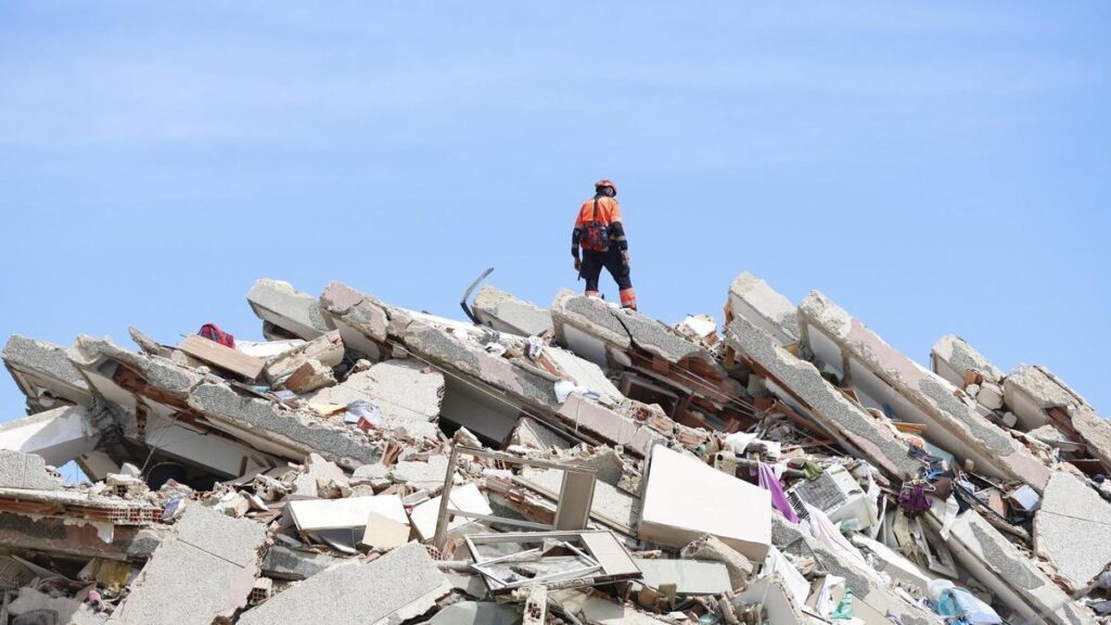 LA GUAIRA, June 29, 2026  -- A rescuer stands on the rubble of a collapsed building in Caraballeda, La Guaira state, Venezuela, June 28, 2026. Venezuelan National Assembly President Jorge Rodriguez said Sunday that the death toll from two powerful earthqu